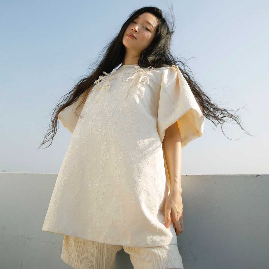 Rotsaniyom Cream long blouse with bow detail