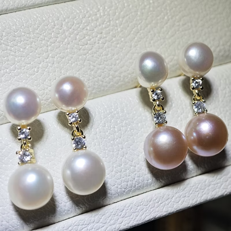 E104 ต่างหูไข่มุกแท้ มี สองสี ขาว ชมพู