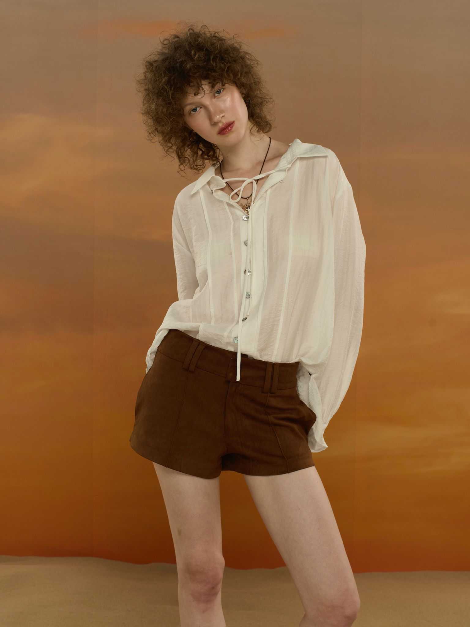 STUDIO UNKNOWN - Kay Suede Shorts  กางเกงขาสั้นเอวต่ำตกแต่งเกล็ดหน้า