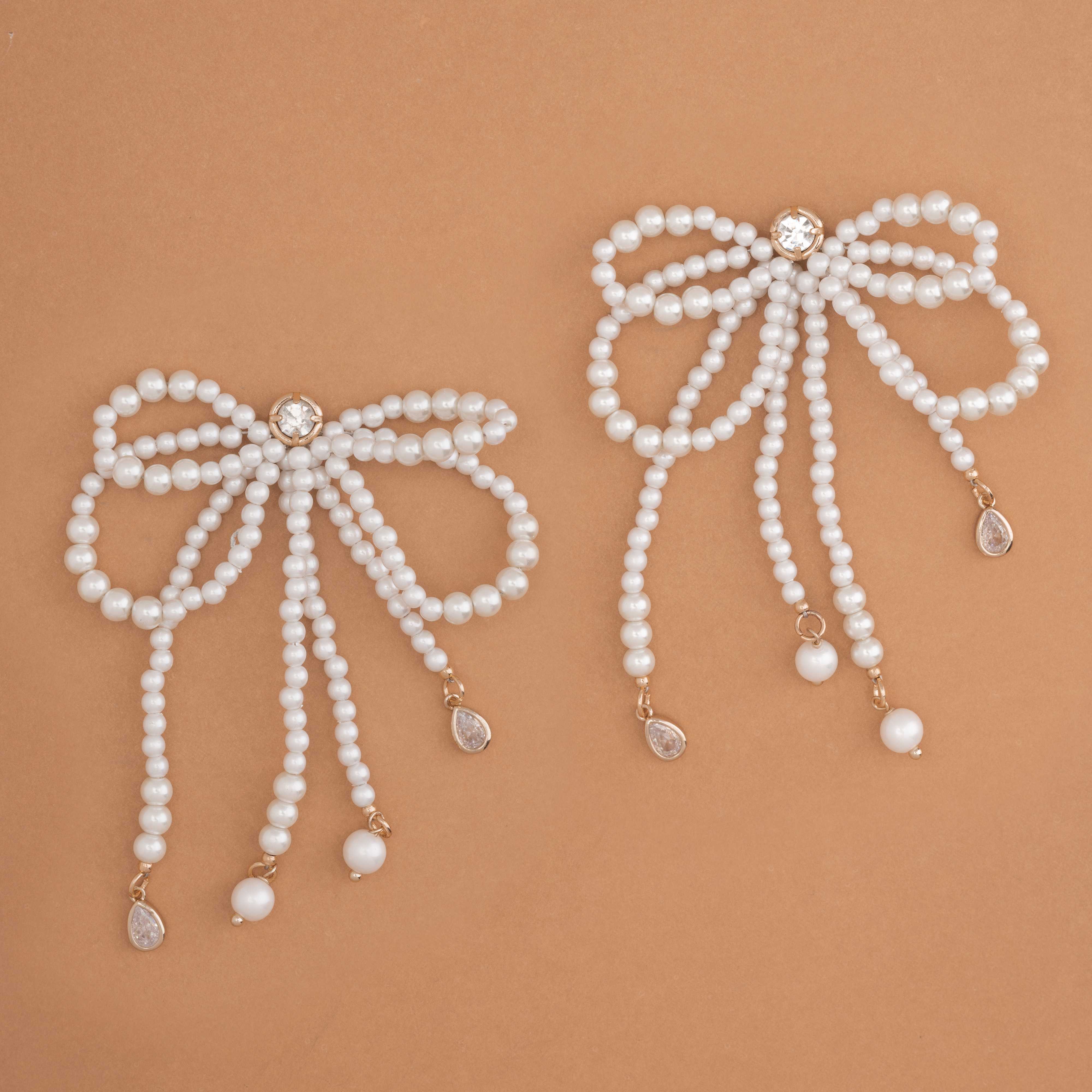 WHITE PEARL BOW STATEMENT EARRINGS