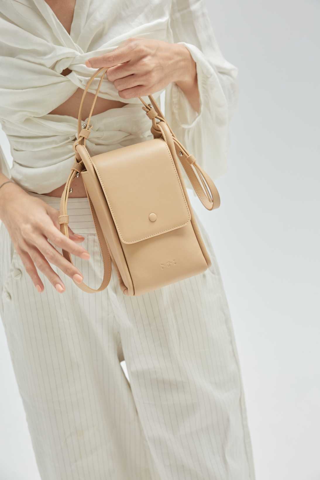 emily. - compact crossbody in beige