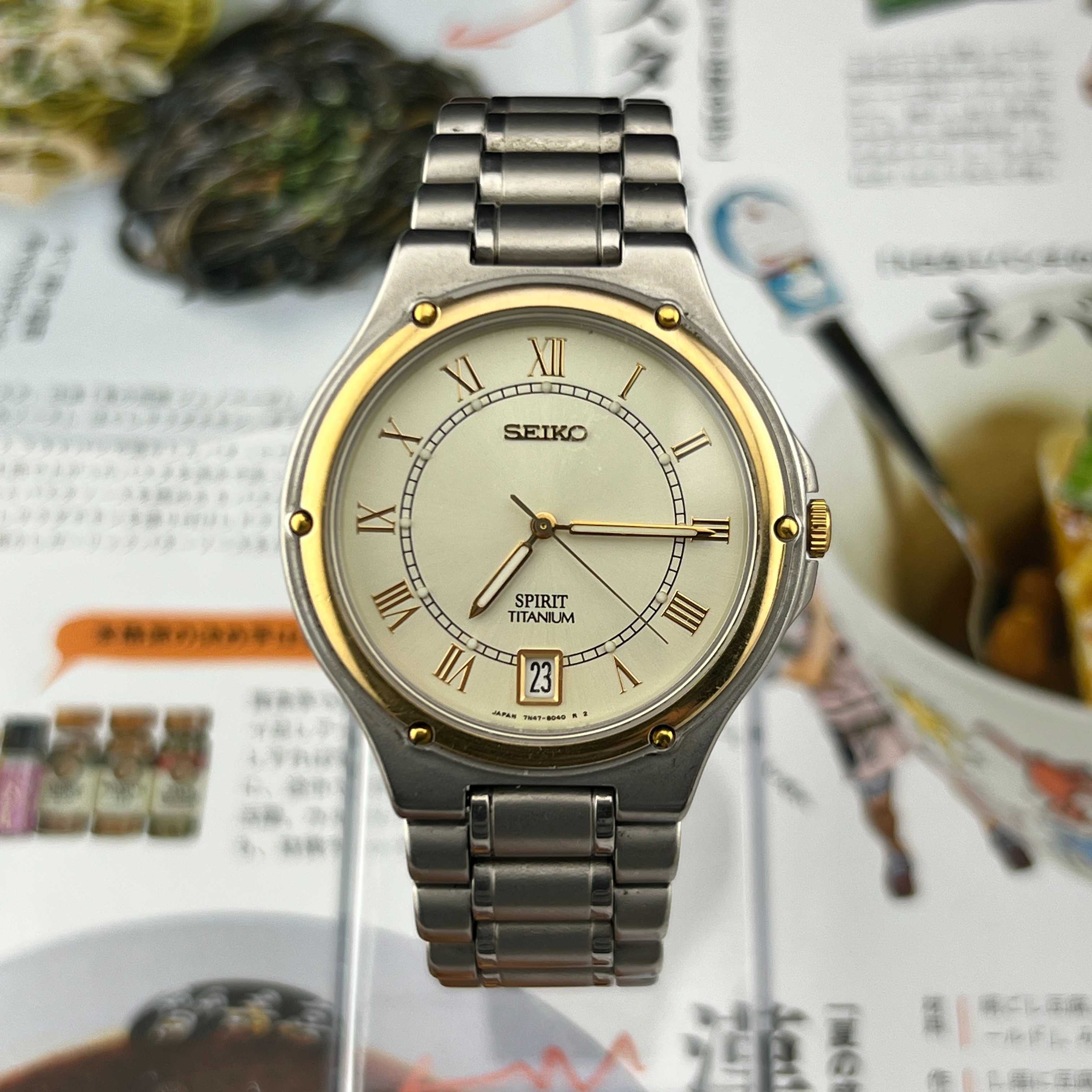 Vintage Seiko Spirit Titanium Roman Quartz Gold Champagne Dial Ref.7N47-8000 Date Japan 1995