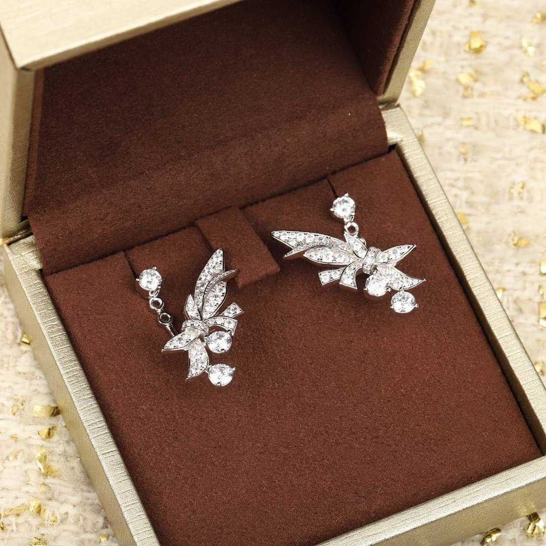 bird fly diamond earrings