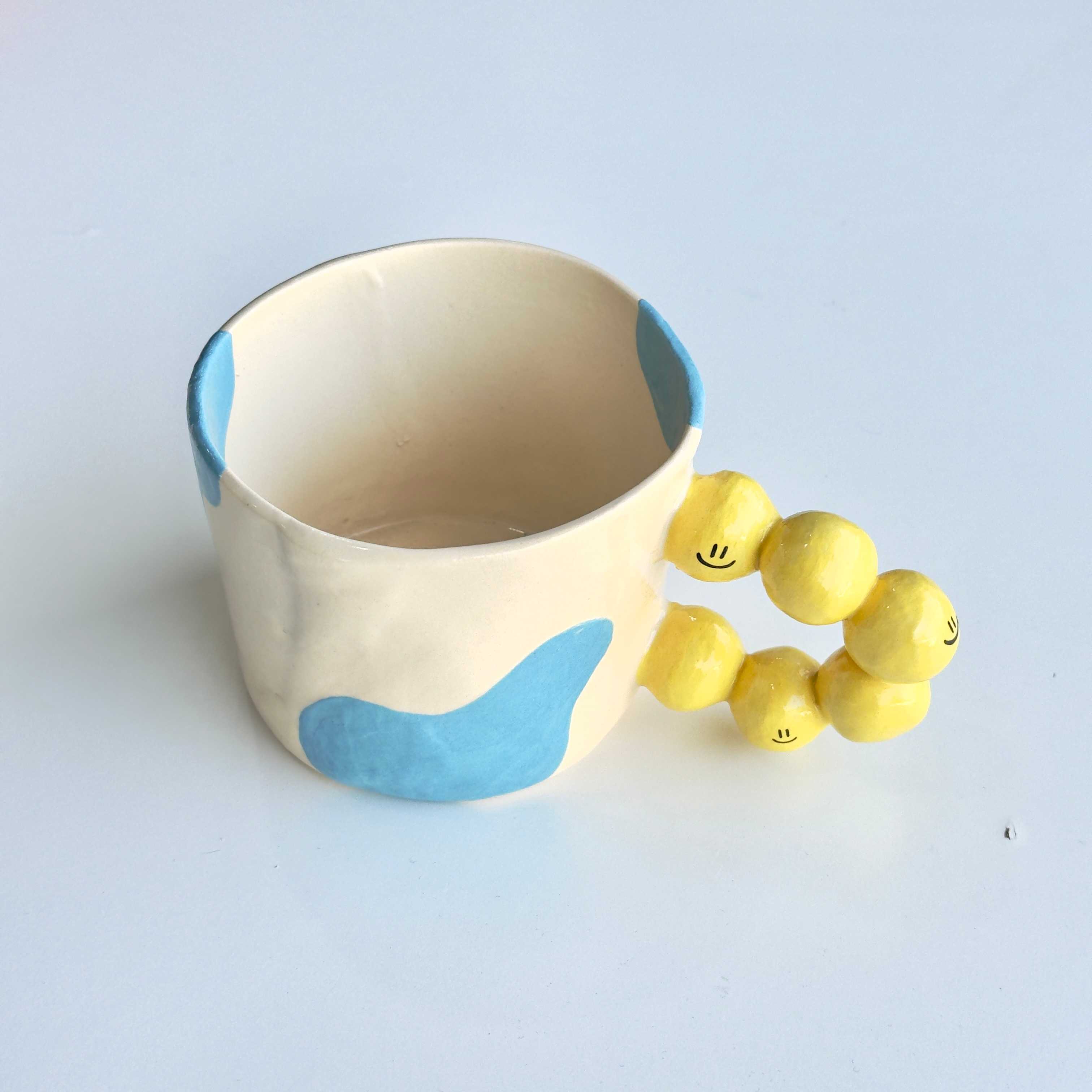 Yellow smiley Handle Mug