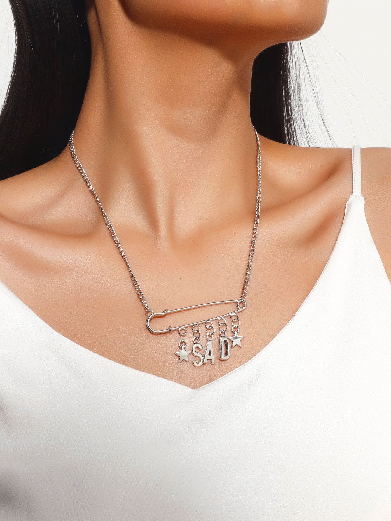 Sad star charm necklace 