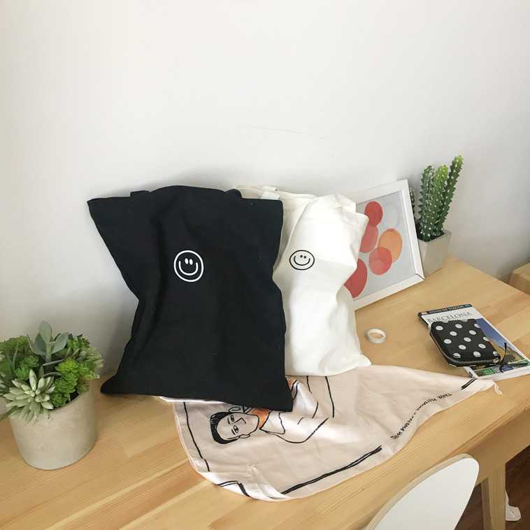 smile in black and white bag