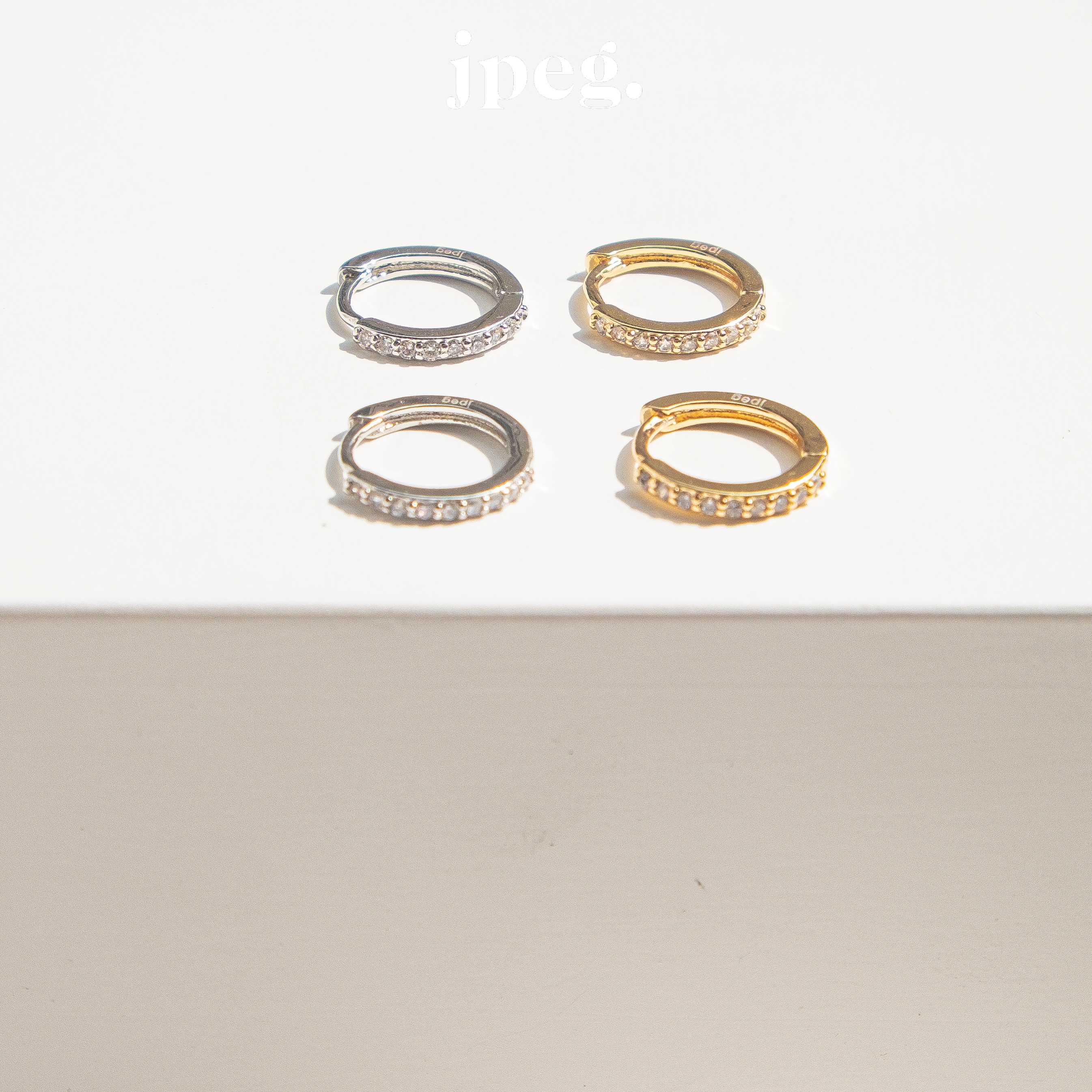 white / diamond huggie hoop earring (brass)