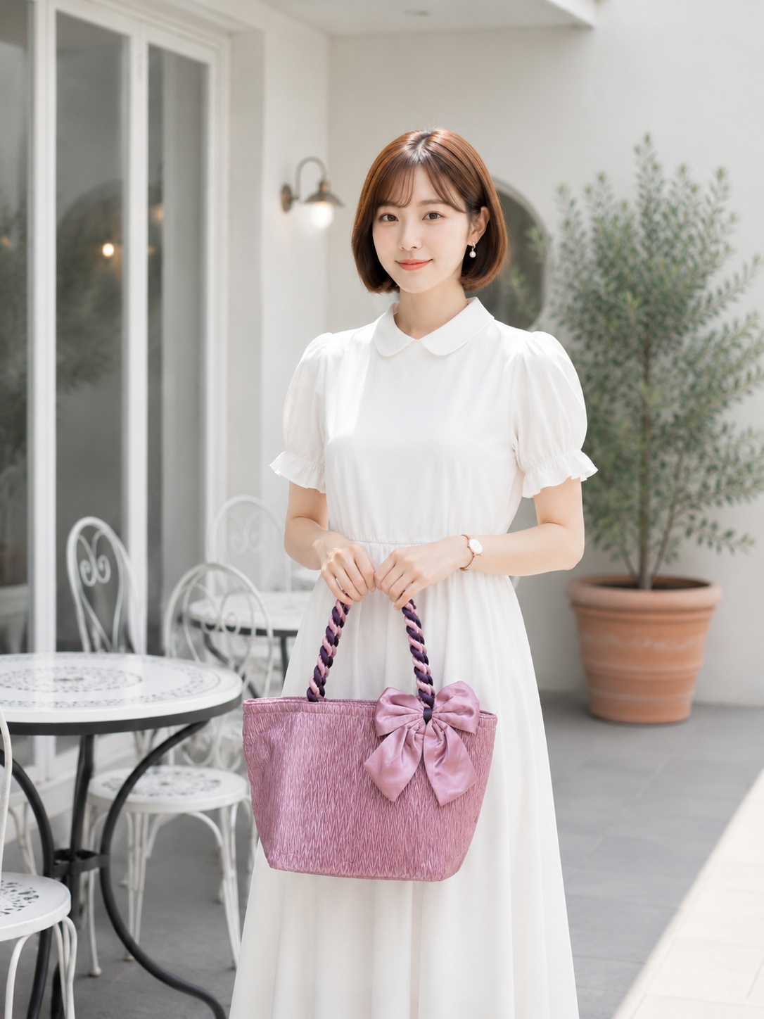 กระเป๋าผ้าซาตินอัดพลีท หูเกรียว สีชมพู โบว์ข้าง