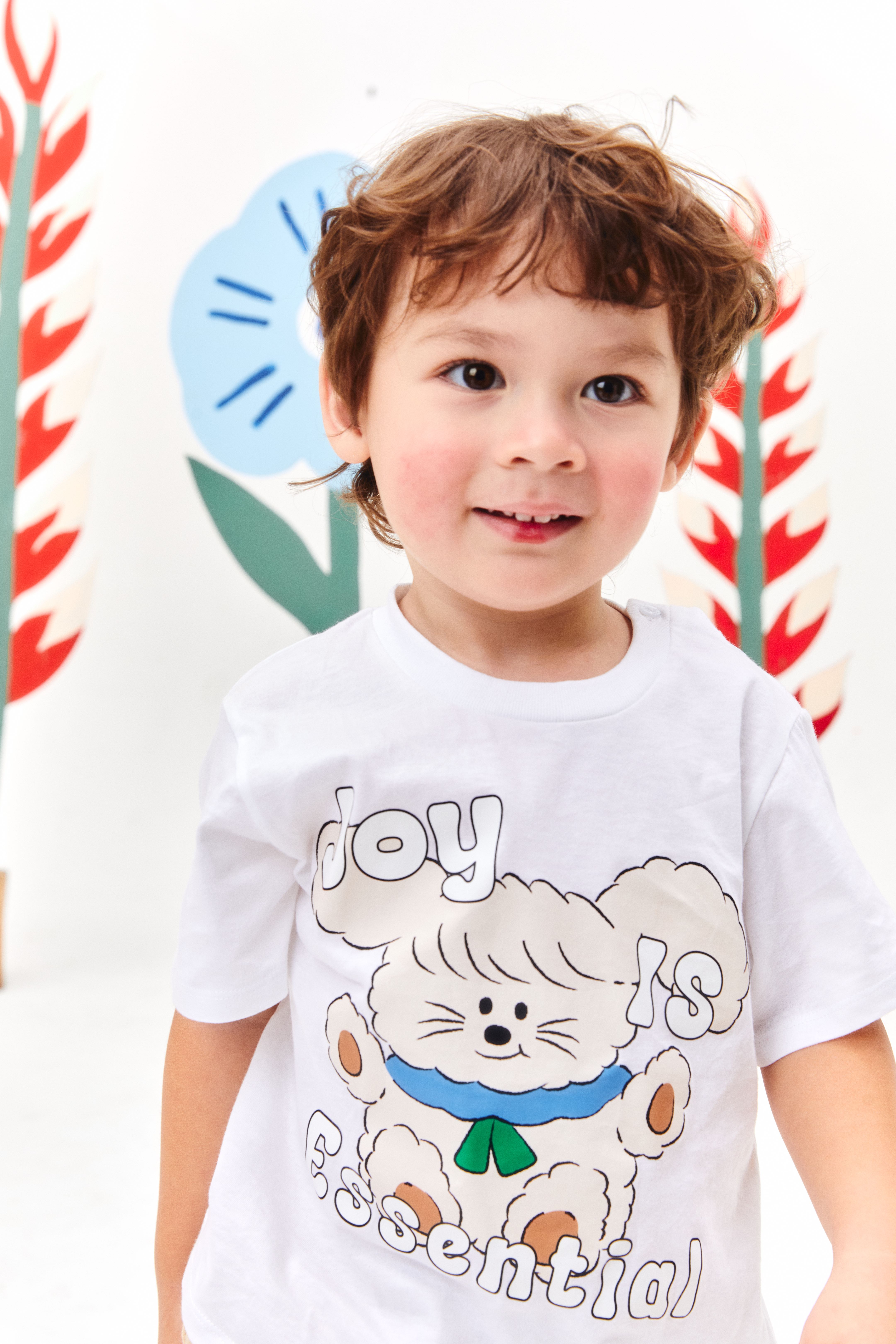 JOY IS ESSENTIAL TEE - Unisex (100%Cotton กระดุมบนไหล่, ตุ๊กตาเย็บข้างเสื้อ)