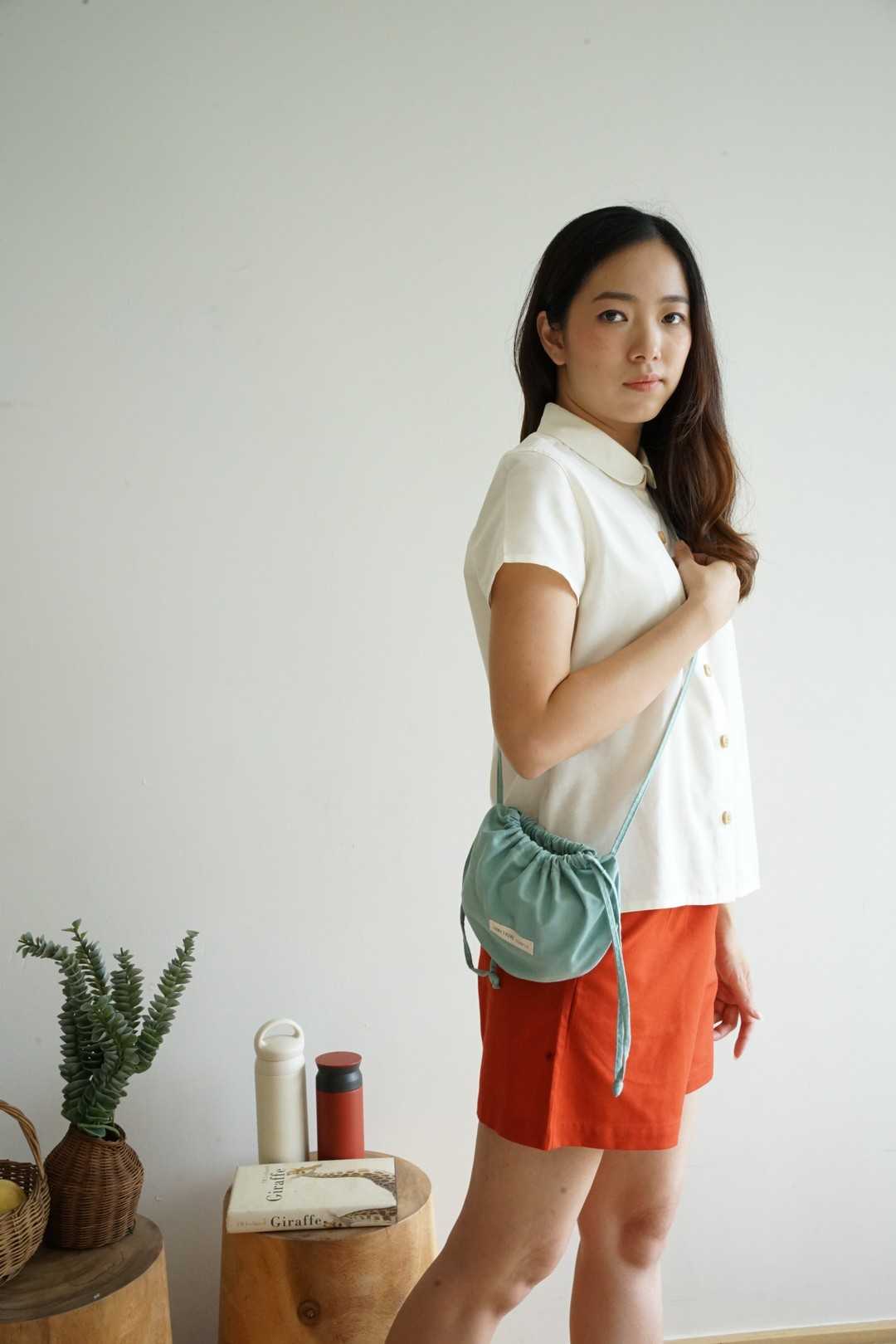 PAO - cross body bag กระเป๋ารูดทรงกลมกระทัดรัด