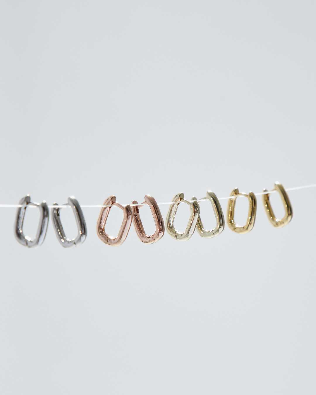 Julys - egg huggie earrings