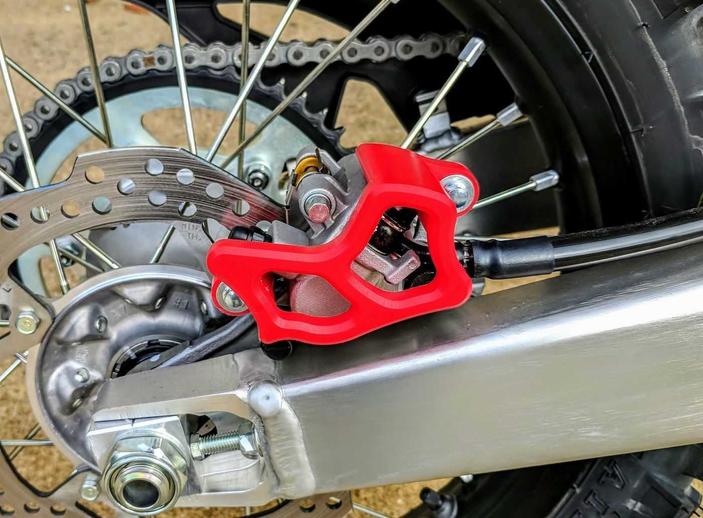 การ์ดปั้มเบรค TM Designworks Rear Brake Caliper Guard