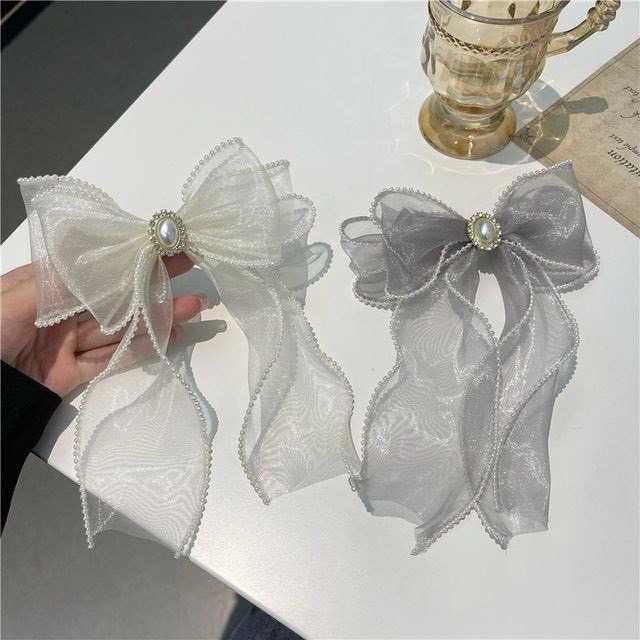 A027 โบว์ชิฟฟ่อนแต่งมุกล้อมเพชร มี 2 สี