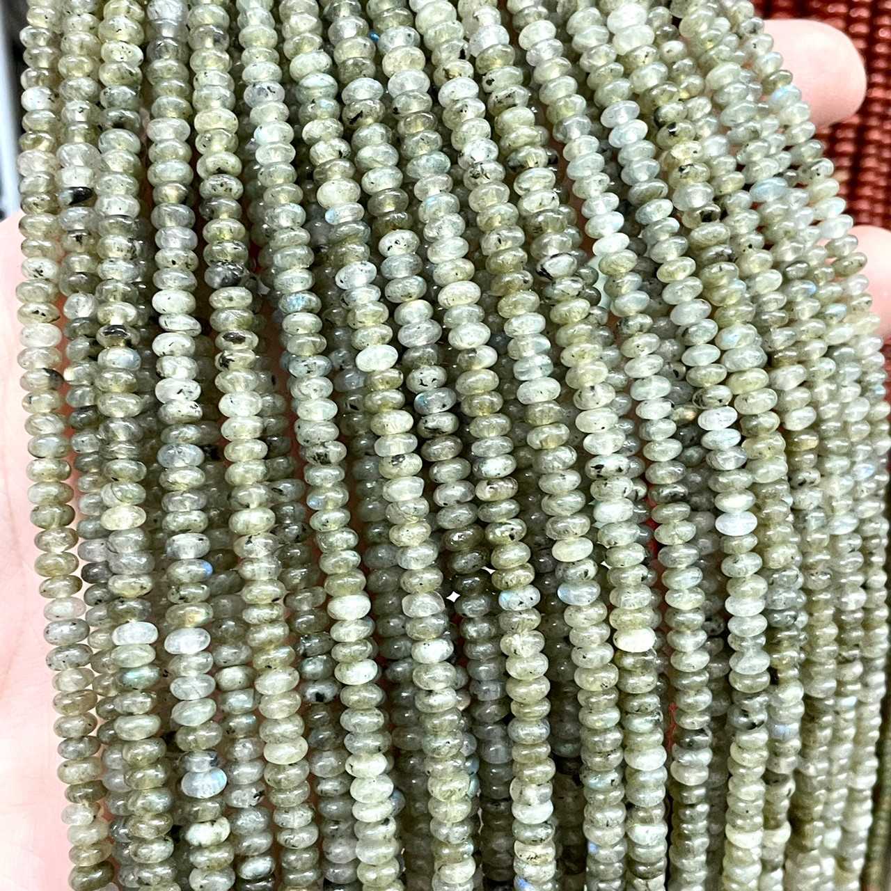 ลาบาโดไลท์ (เนื้อเขียว) Labradorite ขนาด 2x4 mm ทรงล้อรถ เส้นยาว