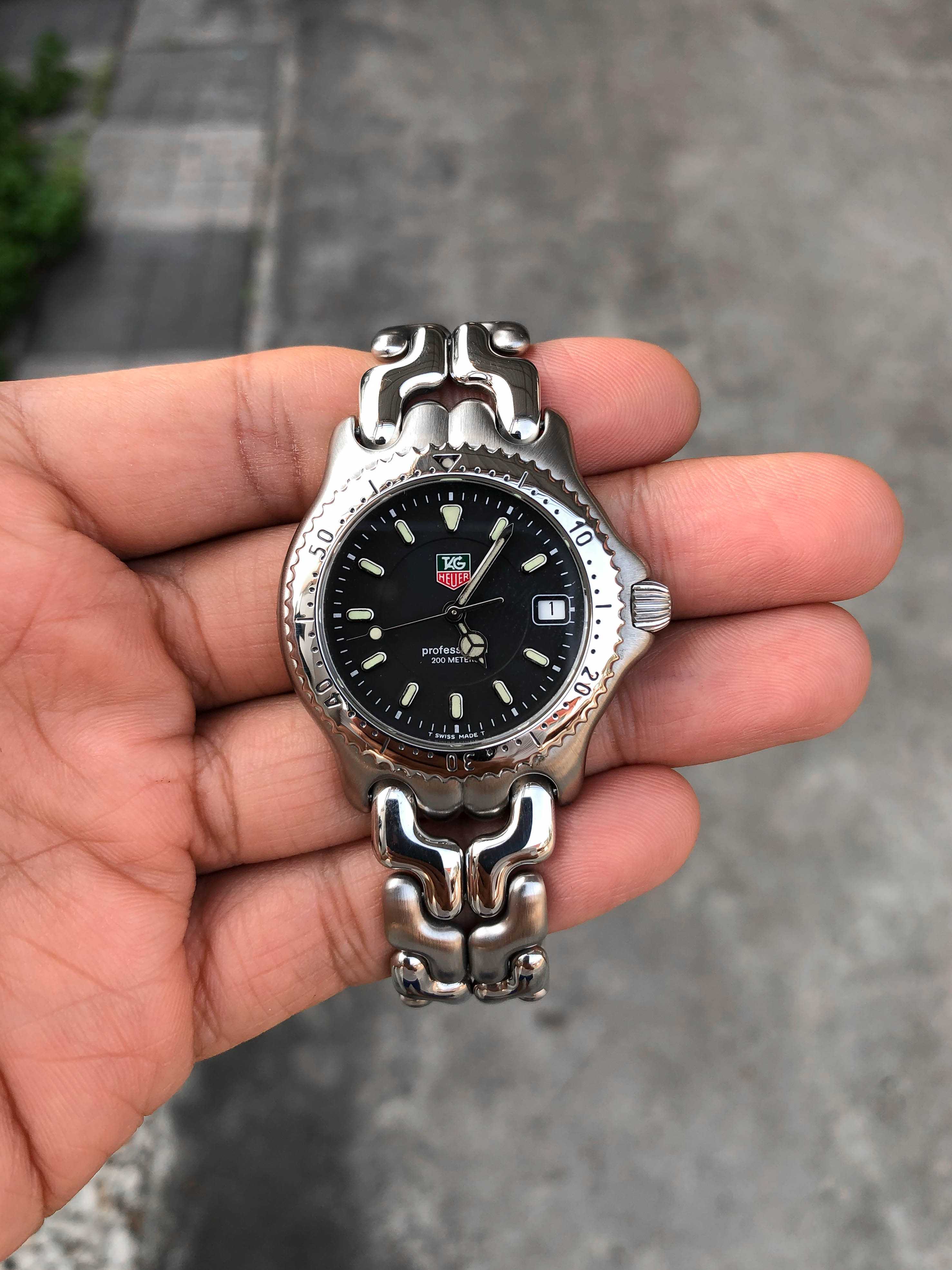 Tag Heuer ก้างปลา Boy Size Quartz เรือนเหล็ก สายเงาสลับด้าน หน้าดำ 2ชั้น