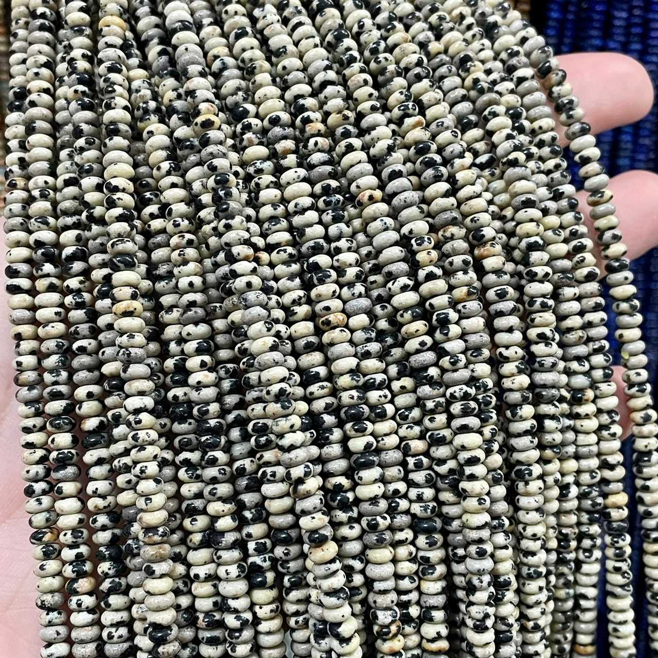 ดัลเมเชี่ยล แจสเปอร์ (Dalmatian Jasper) ขนาด 2x4 mm ทรงล้อรถ เส้นยาว