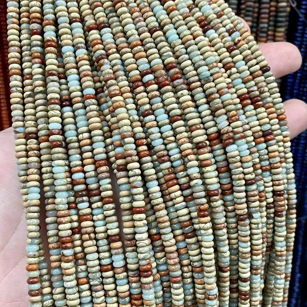 แจสเปอร์ หนังงู (Impression jasper) ขนาด 2x4 mm ทรงล้อรถ เส้นยาว