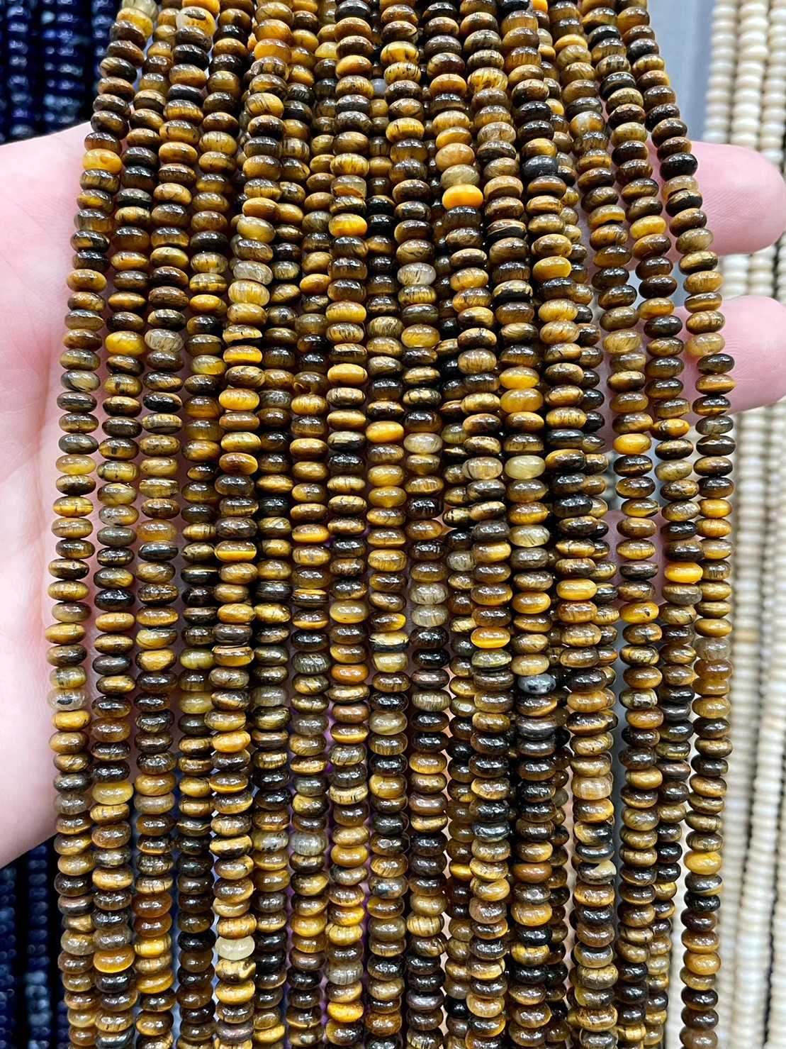 ตาเสือเหลือง(Tiger Eye) ขนาด 2x4 mm ทรงล้อรถ เส้นยาว