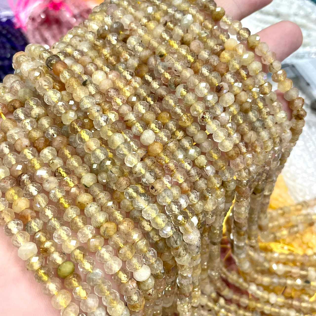 ไหมทอง(Gold Rutilated Quart) ทรงล้อรถ เจียเหลี่ยมเหลี่ยม 6x4 mm เส้นยาว