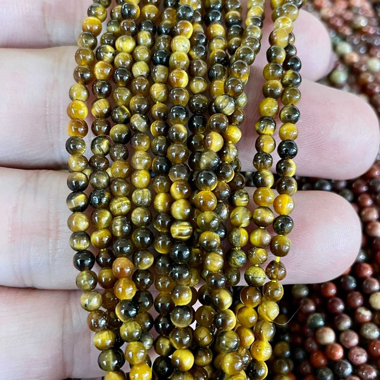 ตาเสือสีเหลือง (Yellow Tiger's Eye) 3 mm ทรงกลม เส้นยาว