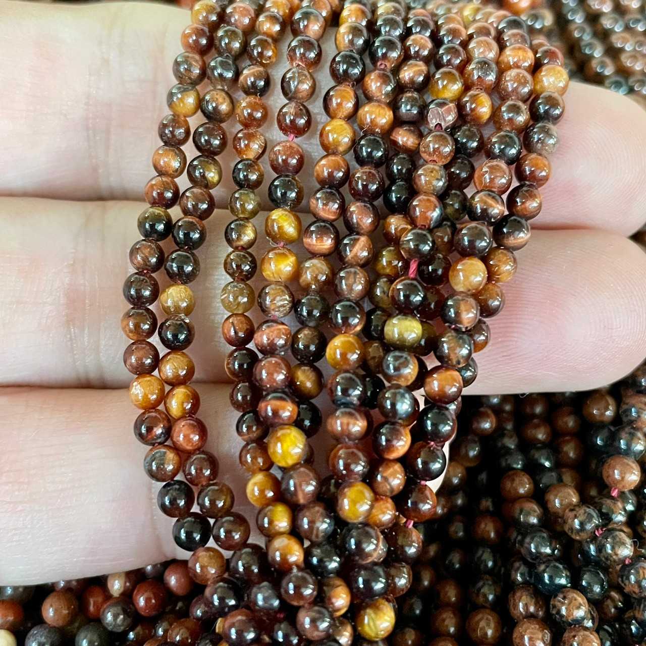 ตาเสือแดง (Red Tiger's Eye) 3 mm ทรงกลม เส้นยาว