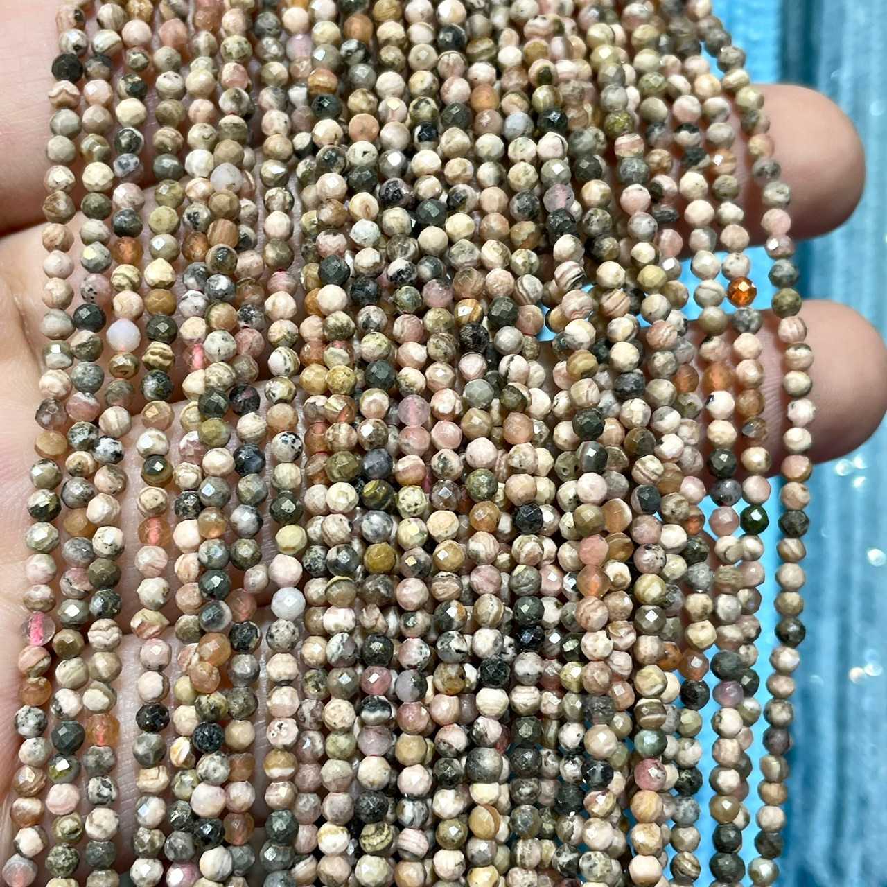โรโดโครไซต์ (Rhodochrosite) 2 mm เจียเหลี่ยม เส้นยาว