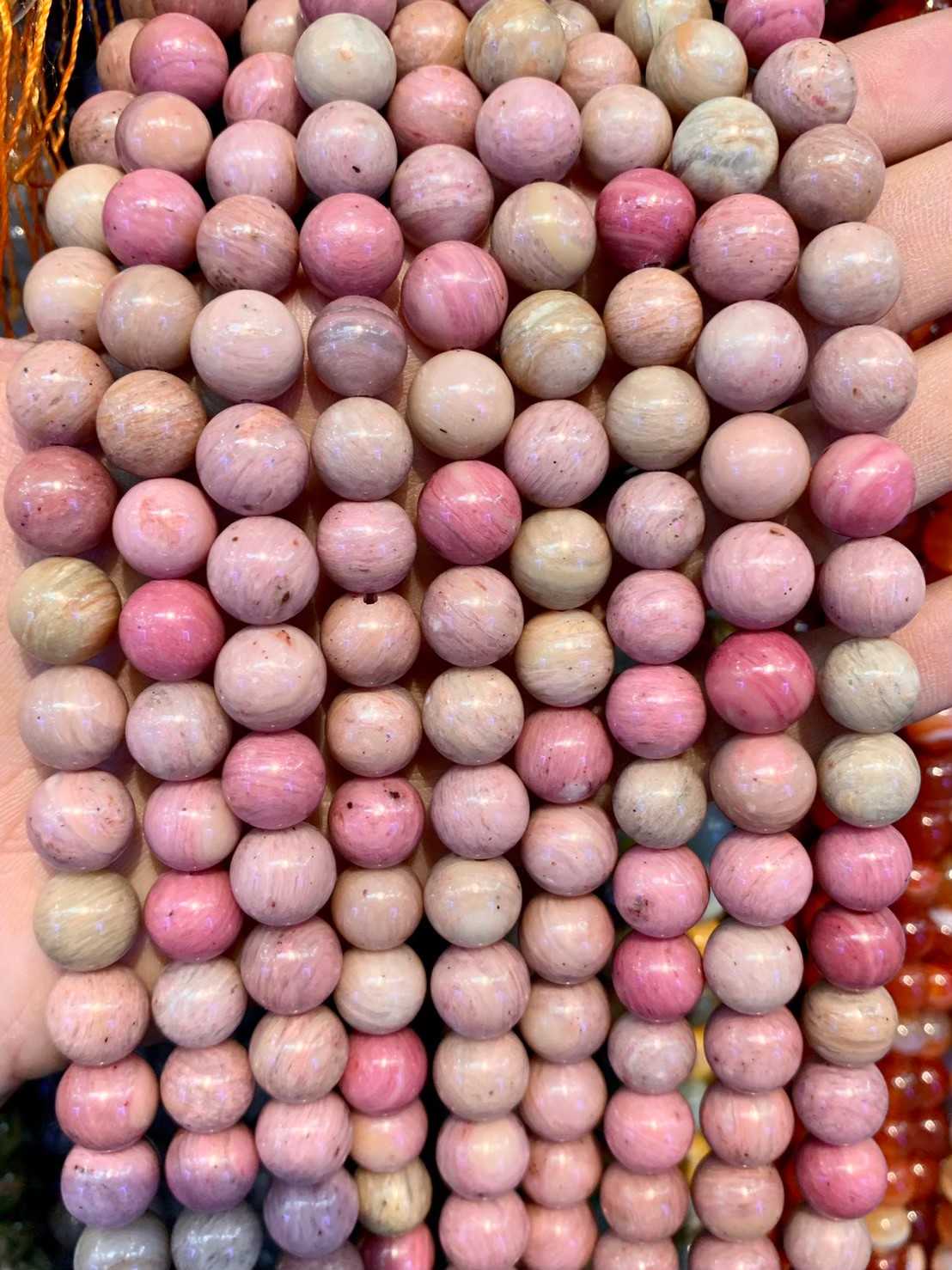 โรโดไนท์ (Pink Rhodonite) ทรงกลม เส้นยาว