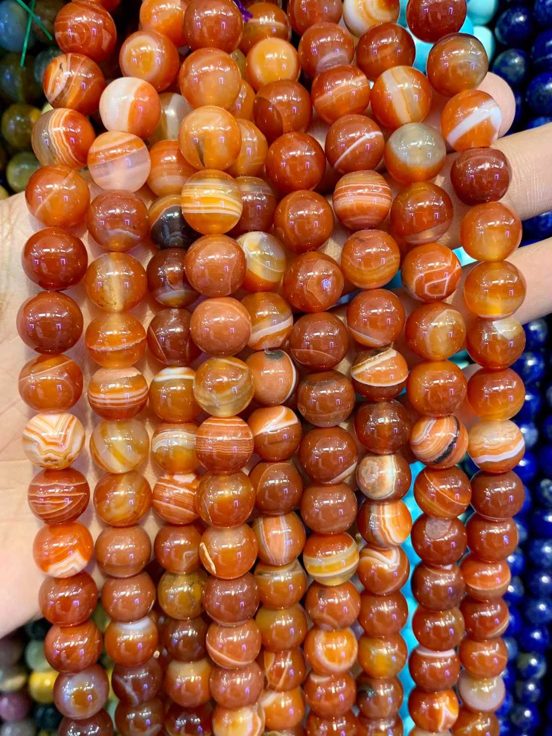 อาเกต สีส้ม (Orange Agate) ทรงกลม เส้นยาว
