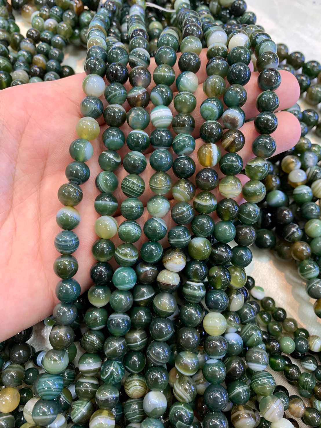 อาเกตบอสวาน่า สีเขียว (Green Boswana Agate) ทรงกลม เส้นยาว