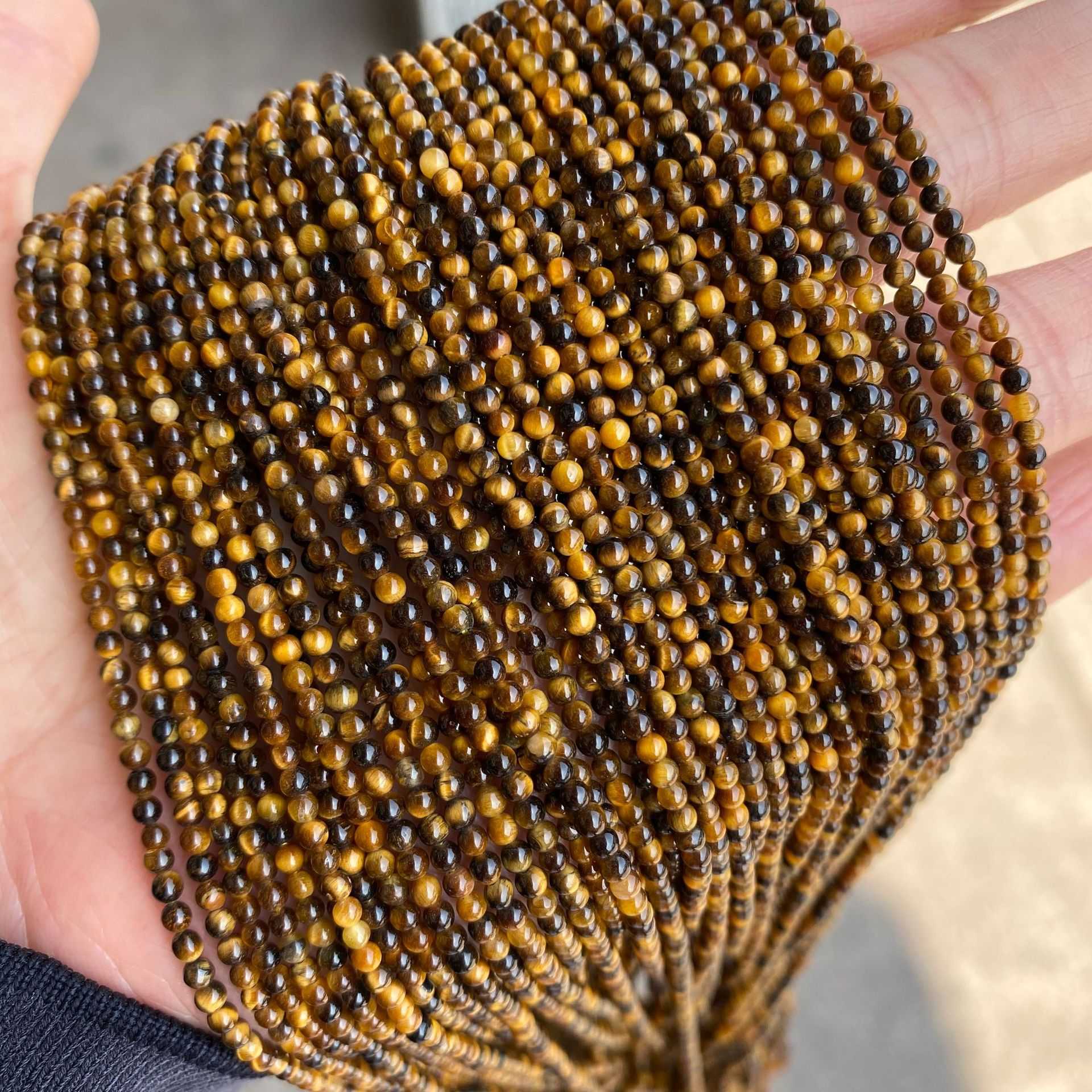 ตาเสือ สีเหลือง (Yellow Tiger Eye's) ขนาด 2 mm ทรงกลม เส้นยาว