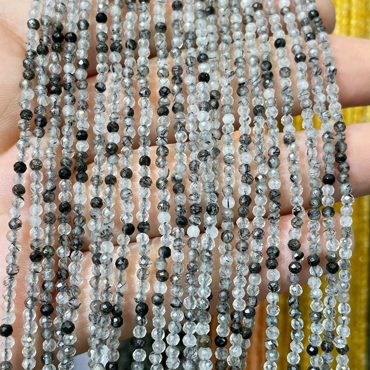แก้วขนเหล็ก / ไหมดำ (Black Rutilated) 2 mm เจียเหลี่ยม เส้นยาว