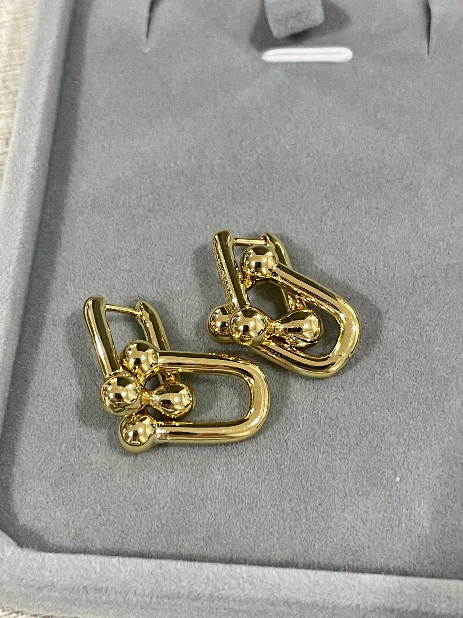 Trinity yellow gold clip on earrings