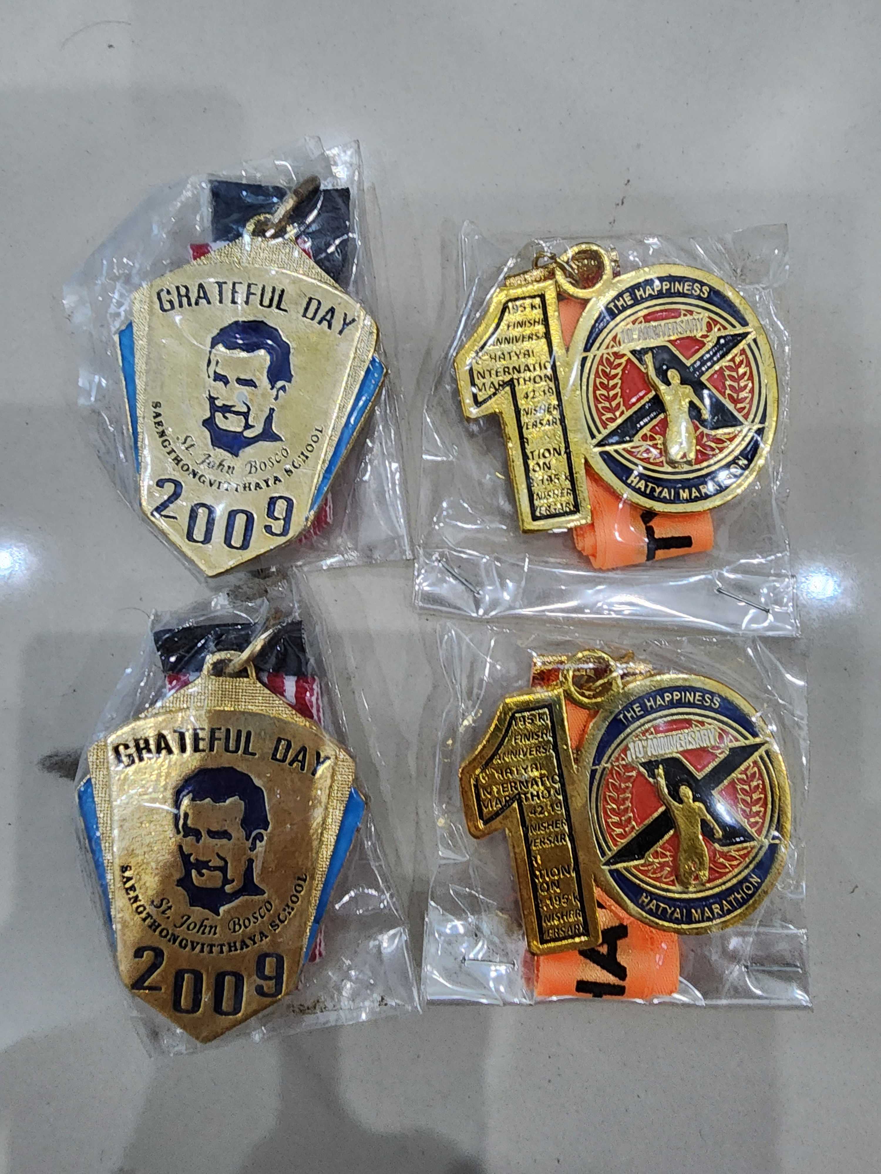 ราคาต่อ 4 ชิ้น เหรียญ วิ่งฟันรัน ปี 2009 จำนวน 4 เหรียญ ของใหม่ เก่าเก็บ สวยมากครับ