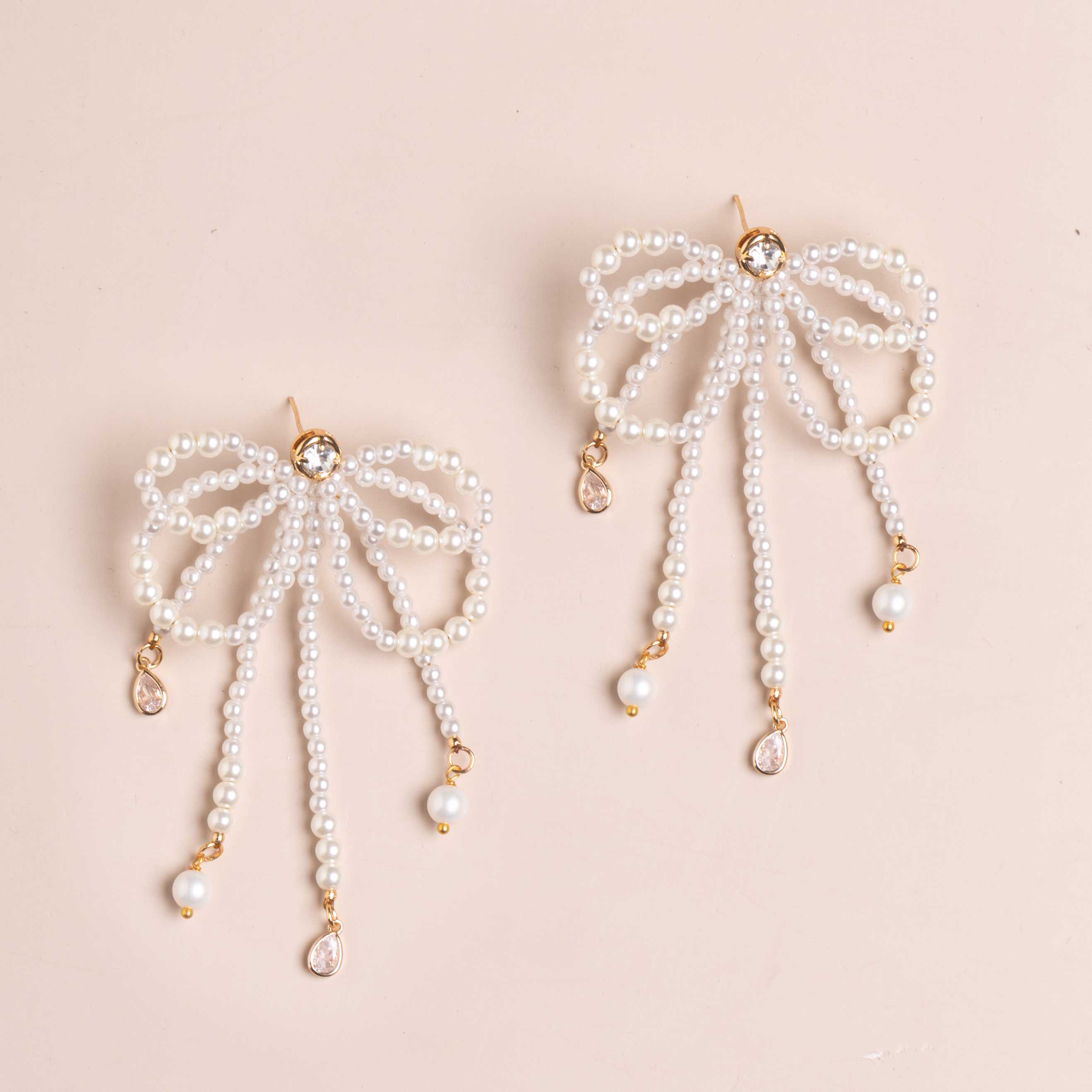 WHITE PEARL BOW STATEMENT EARRINGS