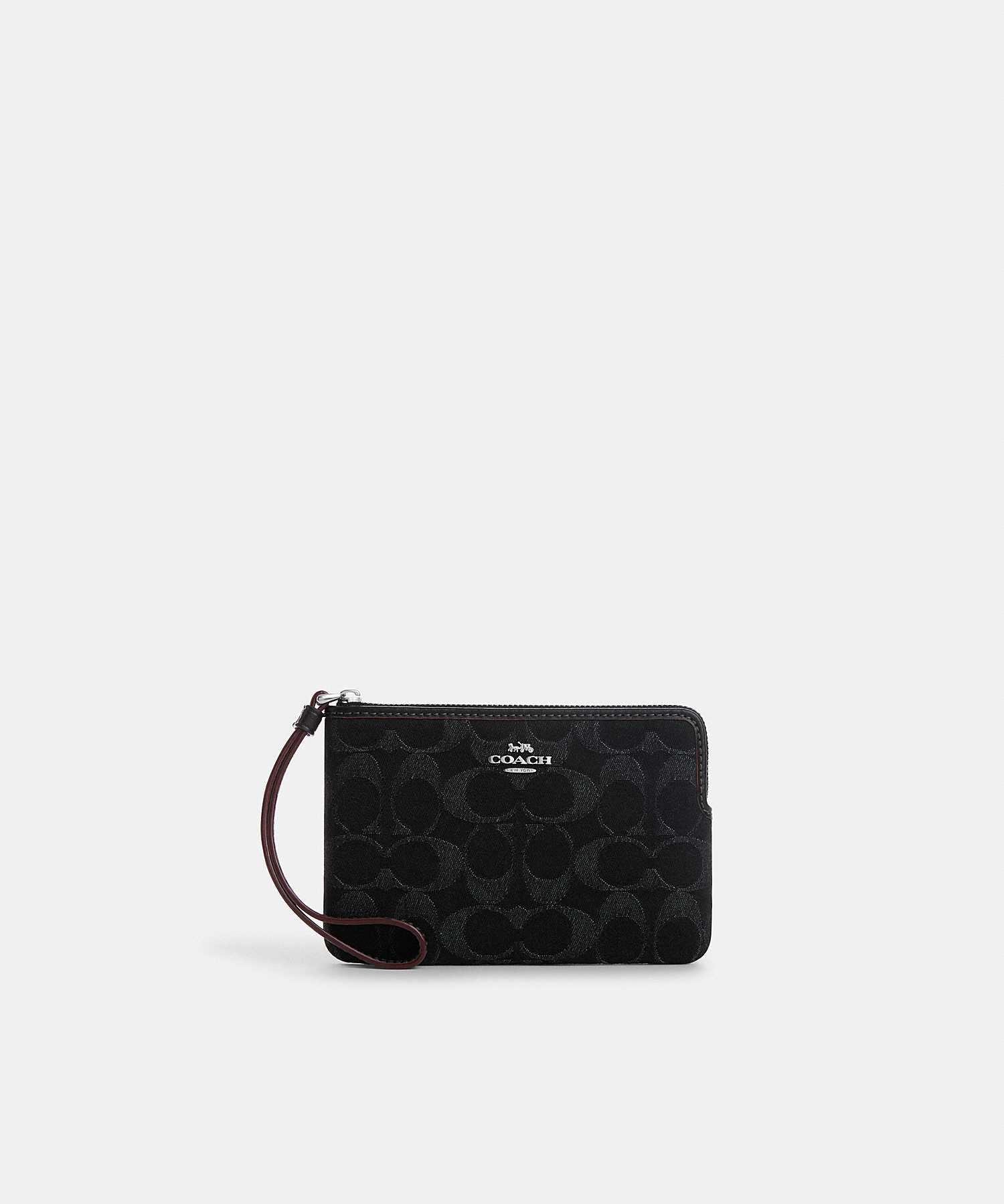 COACH CORNER ZIP WRISTLET IN SIGNATURE DENIM CP440 SV/BK
