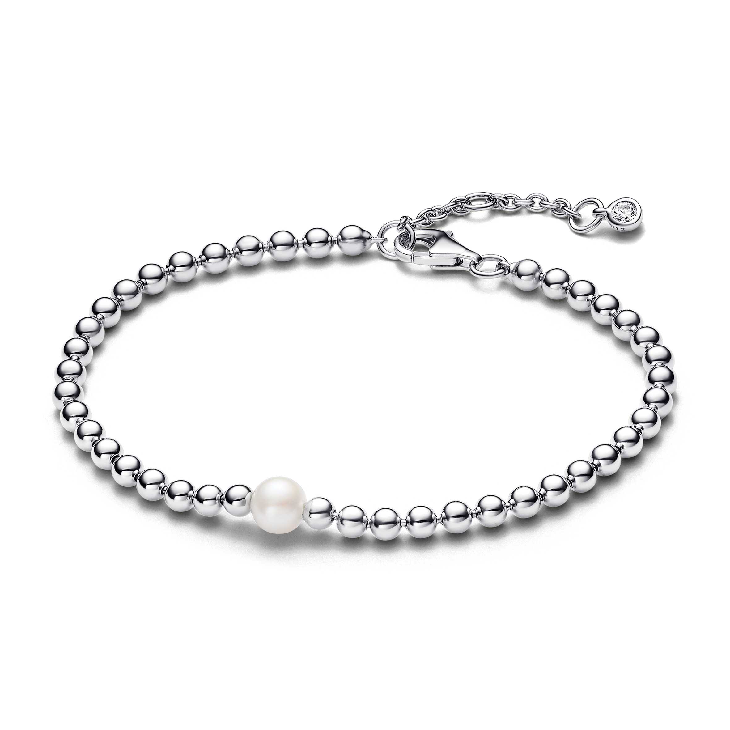 Sterling silver bracelet with white treated freshwater cultured pearl and clear cubic zirconia