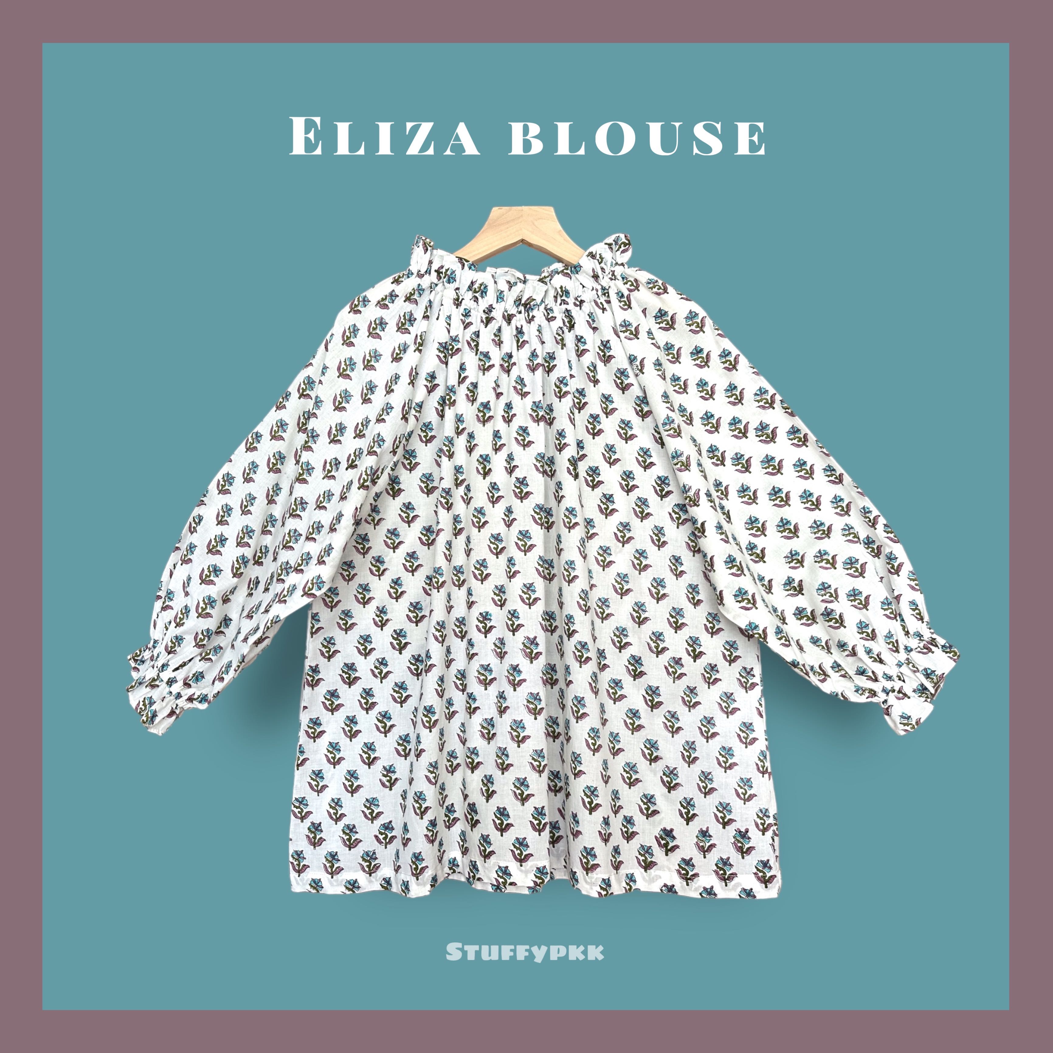 𝐄𝐥𝐢𝐳𝐚 เสื้อคอระบายสีขาว ดอกม่วงฟ้า